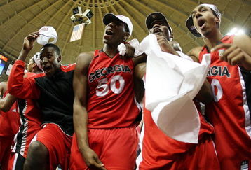 ATLANTA - MARCH 16:  Jeremy Price #50 and other members of the Georgia Bulldogs celebrate after defeating the Arkansas Razorbacks 66-57 during the championship game of the SEC Men's Basketball tournament on March 16, 2008 at Alexander Memorial Coliseum, on the campus of Georgia Tech, in Atlanta Georia.  (Photo by Chris Graythen/Getty Images)