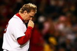 BOSTON - OCTOBER 20:  Starting pitcher Curt Schilling #38 of the Boston Red Sox kisses his necklace as he says a prayer before taking on the Cleveland Indians in Game Six of the American League Championship Series at Fenway Park on October 20, 2007 in Boston, Massachusetts.  (Photo by Al Bello/Getty Images)