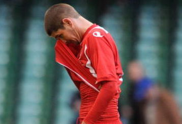 CARDIFF, UNITED KINGDOM - MARCH 28:  Carl Robinson of Wales leaves the field looking dejected during the FIFA 2010 World Cup Qualifier Group 4 match between Wales and Finland at the Millennium Stadium on March 28, 2009 in Cardiff, Wales.  (Photo by Christopher Lee/Getty Images)