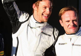 MELBOURNE, AUSTRALIA - MARCH 28:  Jenson Button (L) of Great Britain and Brawn GP celebrates taking pole position with second placed team mate Rubens Barrichello (R) of Brazil and Brawn GP following qualifying for the Australian Formula One Grand Prix at the Albert Park Circuit on March 28, 2009 in Melbourne, Australia.  (Photo by Mark Thompson/Getty Images)