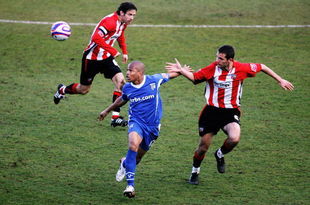 LONDON, ENGLAND - MARCH 28:  Mark Phillips of Brentford (R) tussles with Simeon Jackson of Gillingham during the Coca-Cola League Two match between Brentford and Gillingham at Grifffin Park on March 28, 2009 in London, England.  (Photo by Dean Mouhtaropoulos/Getty Images)