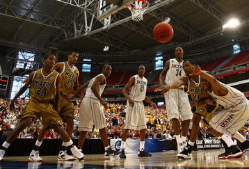 GLENDALE, AZ - MARCH 28:  Guard Zaire Taylor #11 of the Missouri Tigers and guard Kemba Walker #15 of the Connecticut Huskies dive after a loose ball in the Elite Eight of the NCAA Division I Men's Basketball Tournament at the University of Phoenix Stadium on March 28, 2009 in Glendale, Arizona.  (Photo by Ronald Martinez/Getty Images)