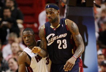 MIAMI - DECEMBER 30:  LeBron James #23 of the Cleveland Cavaliers is guarded closely by Dwyane Wade #3 of the Miami Heat at American Airlines Arena on December 30, 2008 in Miami, Florida. The Heat defeated the Cavaliers 104-95. NOTE TO USER: User expressly acknowledges and agrees that, by downloading and/or using this Photograph, user is consenting to the terms and conditions of the Getty Images License Agreement.  (Photo by Doug Benc/Getty Images)
