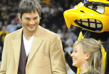 IOWA CITY, IA - DECEMBER 12: Olympic medalist Shawn Johnson (R) and actor Ashton Kutcher are honored during halftime of the Iowa-Iowa State college basketball game on December 12, 2008 at the University of Iowa in Iowa City, Iowa. Johnson and Kutcher, both from Iowa, were in Iowa City raising money for flood relief charities in Eastern Iowa after a 500 year flood devastated the area. (Photo by David Greedy/Getty Images)