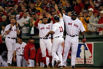 BOSTON - OCTOBER 16:  Mark Kotsay #11 of the Boston Red Sox is greeted by teammates David Ortiz #34 and Jason Varitek #33 after scoring the tying run in the eighth inning against the Tampa Bay Rays in game five of the American League Championship Series during the 2008 MLB playoffs at Fenway Park on October 16, 2008 in Boston, Massachusetts.  (Photo by Elsa/Getty Images)