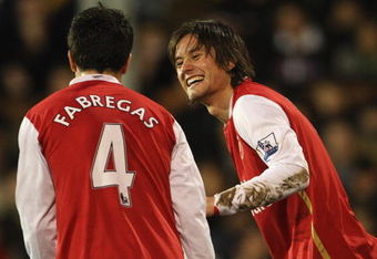 LONDON - JANUARY 19:  Tomas Rosicky of Arsenal (R) celebrates with Francesc Fabregas as he scores their third goal during the Barclays Premier League match between Fulham and Arsenal at Craven Cottage of January 19, 2008 in London, England.  (Photo by Phil Cole/Getty Images)