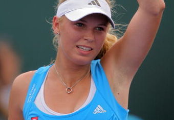KEY BISCAYNE, FL - MARCH 29:  Caroline Wozniacki of Denmark waves to the crowd after defeating Patty Schnyder of Switzerland during the third round of the Sony Ericsson Open at the Crandon Park Tennis Center on March 29, 2009 in Key Biscayne, Florida.  (Photo by Matthew Stockman/Getty Images)