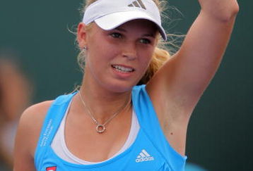 KEY BISCAYNE, FL - MARCH 29:  Caroline Wozniacki of Denmark waves to the crowd after defeating Patty Schnyder of Switzerland during the third round of the Sony Ericsson Open at the Crandon Park Tennis Center on March 29, 2009 in Key Biscayne, Florida.  (Photo by Matthew Stockman/Getty Images)