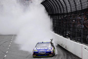 MARTINSVILLE, VA - MARCH 29:  Jimmie Johnson, driver of the #48 Lowe's Chevrolet, does a burnout after winning the NASCAR Sprint Cup Series Goody's Fast Pain Relief 500 at the Martinsville Speedway on March 29, 2009 in Martinsville, Virginia.  (Photo by Rusty Jarrett/Getty Images for NASCAR)