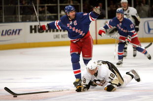 NEW YORK - APRIL 29:  Jaromir Jagr #68 of the New York Rangers hooks Marian Hossa #18 of the Pittsburgh Penguins who dives for the puck during Game 3 of the Eastern Conference Semifinals of the 2008 NHL Stanley Cup Playoffs at Madison Square Garden on April 29th, 2008 in New York City.  Jagr recieved a two minute penalty for hooking while Hossa recieved a two minute penalty for unsportsmanlike diving.  (Photo by Bruce Bennett/Getty Images)