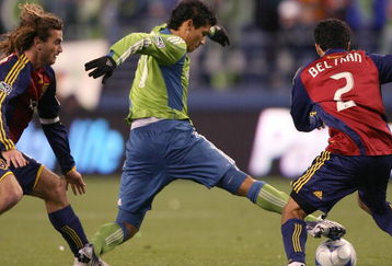 SEATTLE - MARCH 28:  Seattle Sounders FC forward Fredy Montero #17 battles Kyle Beckerman #5 (L) and Tony Beltran #2 of Real Salt Lake on March 28, 2009 at Qwest Field in Seattle, Washington.  The Sounders defeated Real Salt Lake 2-0. (Photo by Otto Greule Jr/Getty Images)