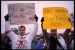 19 Nov 1995: Fans hold various signs which accuses Cleveland Browns owner Art Modell of disregard of fans at Cleveland Stadium in Cleveland, Ohio. The Packers defeated the Browns that day 31-20.