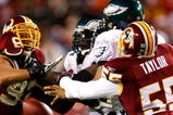 LANDOVER, MD - DECEMBER 21:  Jason Taylor #55 of the Washington Redskins forces a fumble as he knocks the ball out of the hands of quarterback Donovan McNabb #5 of the Philadelphia Eagles during the game on December 21, 2008 at FedEx Field in Landover, Maryland.  (Photo by Kevin C. Cox/Getty Images)