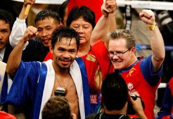 LAS VEGAS - DECEMBER 06:  (L-R) Manny Pacquiao of the Philippines celebrates with his trainer Freddie Roach after defeating Oscar De La Hoya in their welterweight fight at the MGM Grand Garden Arena December 6, 2008 in Las Vegas, Nevada.  (Photo by Ethan Miller/Getty Images)