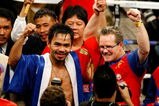 LAS VEGAS - DECEMBER 06:  (L-R) Manny Pacquiao of the Philippines celebrates with his trainer Freddie Roach after defeating Oscar De La Hoya in their welterweight fight at the MGM Grand Garden Arena December 6, 2008 in Las Vegas, Nevada.  (Photo by Ethan Miller/Getty Images)