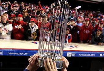 PHILADELPHIA - OCTOBER 29:  The World Series Championship trophy is held up in front of fans of the Philadelphia Phillies after they won 4-3 against the Tampa Bay Rays during the continuation of game five of the 2008 MLB World Series on October 29, 2008 at Citizens Bank Park in Philadelphia, Pennsylvania.  (Photo by Jed Jacobsohn/Getty Images)