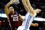 MEMPHIS, TN - MARCH 29:  Tyler Hansbrough #50 of the North Carolina Tar Heels goes up for a dunk over Blake Griffin #23 of the Oklahoma Sooners in the second half during the NCAA Men's Basketball Tournament South Regional Final at the FedExForum on March 29, 2009 in Memphis, Tennessee. The Tar Heels defeated the Sooners 72-60 to advance to the Final Four. (Photo by Joe Murphy/Getty Images)