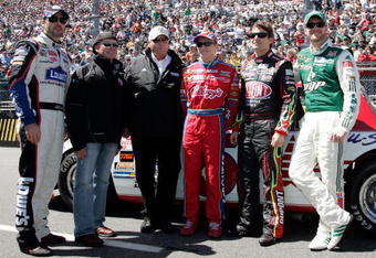 MARTINSVILLE, VA - MARCH 29: (L-R) The Hendrick Motorsports team including Jimmie Johnson, driver of the #48 Lowe's Chevrolet, Geoffrey Bodine, Team Owner Rick Hendrick, Mark Martin, driver of the #5 CARQUEST/Kellogg's Chevrolet, Jeff Gordon, driver of the #24 DuPont Chevrolet, and Dale Earnhardt Jr., driver of the #88 National Guard/AMP Energy Chevrolet, stand on the grid prior to the start of the NASCAR Sprint Cup Series Goody's Fast Pain Relief 500 at the Martinsville Speedway on March 29, 2009 in Martinsville, Virginia.  (Photo by Jerry Markland/Getty Images for NASCAR)