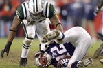 FOXBORO, MA - DECEMBER 22:  Quarterback Tom Brady #10 of the New England Patriots falls to the ground after being sacked by defensive end John Abraham #94 of the New York Jets during the NFL game at Gillette Stadium on December 22, 2002 in Foxboro, Massachusetts. The Jets beat the Patriots 30-17. (Photo by Ezra Shaw/Getty Images))