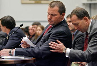 WASHINGTON - FEBRUARY 13: Major League Baseball pitcher Roger Clemens (L) gets a note from his attorney Lanny Breuer while he testifies about allegations of steroid use by professional ball palyers before the U.S. House Oversight and Government Reform Committee on Capitol Hill February 13, 2008 in Washington, DC. The 'Mitchell Report' named several former and current major league baseball players, including Clemens, who are accused of using steroids or other performance-enhancing drugs.  (Photo by Chip Somodevilla/Getty Images)
