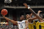 GLENDALE, AZ - MARCH 28:  (L-R) Guard Kemba Walker #15 of the Connecticut Huskies goes up for a shot against forwards Leo Lyons #5 and DeMarre Carroll #1 of the Missouri Tigers in the Elite Eight of the NCAA Division I Men's Basketball Tournament at the University of Phoenix Stadium on March 28, 2009 in Glendale, Arizona.  (Photo by Ronald Martinez/Getty Images)