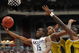 GLENDALE, AZ - MARCH 28:  (L-R) Guard Kemba Walker #15 of the Connecticut Huskies goes up for a shot against forwards Leo Lyons #5 and DeMarre Carroll #1 of the Missouri Tigers in the Elite Eight of the NCAA Division I Men's Basketball Tournament at the University of Phoenix Stadium on March 28, 2009 in Glendale, Arizona.  (Photo by Ronald Martinez/Getty Images)