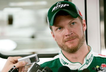 MARTINSVILLE, VA - MARCH 27:  Dale Earnhardt Jr., driver of the #88 National Guard/AMP Energy Chevrolet, talks to the media in the garage area during practice for the NASCAR Sprint Cup Series Goody�s Fast Pain Relief 500 at the Martinsville Speedway on March 27, 2009 in Martinsville, Virginia.  (Photo by Jerry Markland/Getty Images for NASCAR)
