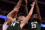 INDIANAPOLIS - MARCH 29:  Goran Suton #14 and Draymond Green #23 of the Michigan State Spartans reach for a rebound against Samardo Samuels #24 of the Louisville Cardinals during the fourth round of the NCAA Division I Men's Basketball Tournament at the Lucas Oil Stadium on March 29, 2009 in Indianapolis, Indiana.  (Photo by Andy Lyons/Getty Images)