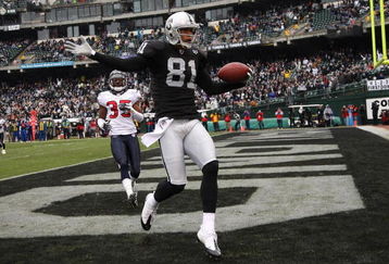 OAKLAND, CA - DECEMBER 21: Chaz Schilens #81 of the Oakland Raiders celebrates scoring a touchdown past Jacques Reeves #35 of the Houston Texans during an NFL game on December 21, 2008 at the Oakland-Alameda County Coliseum in Oakland, California.  (Photo by Jed Jacobsohn/Getty Images)