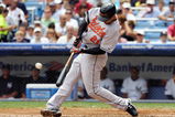 NEW YORK - JULY 30:  Nick Markakis #21 of the Baltimore Orioles connects for a third inning RBI single against the New York Yankees on July 30, 2008 at Yankee Stadium in the Bronx borough of New York City.  (Photo by Jim McIsaac/Getty Images)