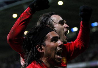BOLTON, UNITED KINGDOM - JANUARY 17:  Dimitar Berbatov (R) of Manchester United celebrates with team mate Carlos Teve after scoring in the final minutes during the Barclays Premier League match between Bolton Wanderers and Manchester United at the Reebok stadium on January 17, 2009 in Bolton, England.  (Photo by Hamish Blair/Getty Images)