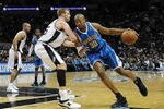 SAN ANTONIO - JANUARY 31:  David West #30 of the New Orleans Hornets drives the ball past Matt Bonner #15 of the San Antonio Spurs on January 31, 2009 at AT&T Center in San Antonio, Texas.  NOTE TO USER: User expressly acknowledges and agrees that, by downloading and/or using this Photograph, user is consenting to the terms and conditions of the Getty Images License Agreement.  (Photo by Ronald Martinez/Getty Images)