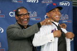 LONG ISLAND CITY, NY - DECEMBER 17:  New York Mets Manager Jerry Manuel helps Francisco Rodriquez put on a Mets jersey for the first time during a press conference to introduce him on December 17, 2008 at the Citigroup Building in New York City.  (Photo by Mike Stobe/Getty Images)