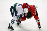 CHICAGO - MARCH 29: Duncan Keith #2 of the Chicago Blackhawks and Alex Burrows #14 of the Vancouver Canucks fight in the third period on March 29, 2009 at the United Center in Chicago, Illinois. The Canucks defeated the Blackhawks 4-0. (Photo by Jonathan Daniel/Getty Images)
