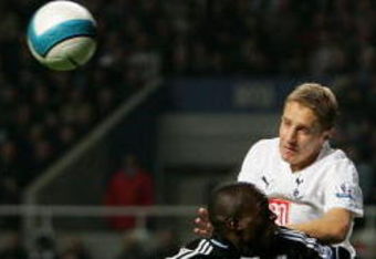NEWCASTLE, UNITED KINGDOM - OCTOBER 22:  Newcastle defender Abdoulaye Faye goes up for a header with Michael Dawson of Spurs during the Barclays Premier League Match between Newcastle United and Tottenham Hotspur at St James' Park on October 22, 2007 in Newcastle, England.  (Photo by Stu Forster/Getty Images)