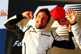 MELBOURNE, AUSTRALIA - MARCH 29:  Jenson Button of Great Britain and Brawn GP celebrates on the podium after winning the Australian Formula One Grand Prix at the Albert Park Circuit on March 29, 2009 in Melbourne, Australia.  (Photo by Clive Mason/Getty Images)
