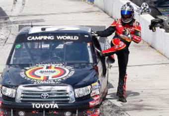 MARTINSVILLE, VA - MARCH 30: Kyle Bush driver of the #51 Miccosukee Toyota climbs from his truck after the NASCAR Camping World Truck Series Kroger 250 at the Martinsville Speedway on March 30, 2009 in Martinsville, Virginia.  (Photo by John Harrelson/Getty Images)