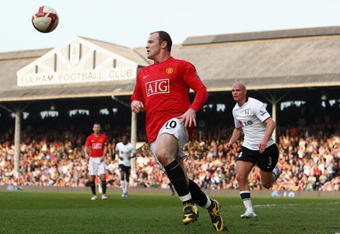 LONDON - MARCH 21:  Wayne Rooney of Manchester United tries to control the ball as he is closed down by Paul Konchesky of Fulham during the Barclays Premier League match between Fulham and Manchester United at Craven Cottage on March 21, 2009 in London, England.  (Photo by Ryan Pierse/Getty Images)