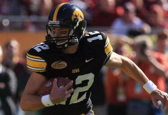 TAMPA, FL - JANUARY 01:  Ricky Stanzi #12 of the Iowa Hawkeyes runs upfield against the South Carolina Gamecocks during the Outback Bowl on January 1, 2009 at Raymond James Stadium in Tampa, Florida.  (Photo by Scott Halleran/Getty Images)