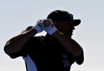 DUNEDIN, FL - MARCH 4:  Outfielder Vernon Wells #10 the Toronto Blue Jays warms up near the batting cage before playing against the USA World Baseball team March 4, 2009 at Dunedin Stadium in Dunedin, Florida.  (Photo by Al Messerschmidt/Getty Images)