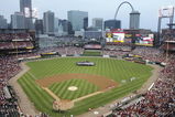 ST. LOUIS - SEPTEMBER 11:  Members of the St. Louis police and fire departments display a U.S. flag in center field as the national anthem is played on the fifth anniversary of the September 11th attacks before the start of the game between the St. Louis Cardinals and the Houston Astros on September 11, 2006 at Busch Stadium in St. Louis, Missouri. (Photo by Elsa/Getty Images)