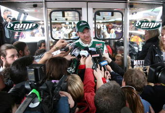 MARTINSVILLE, VA - MARCH 27:  Dale Earnhardt Jr., driver of the #88 National Guard/AMP Energy Chevrolet, talks to the media in the garage area during practice for the NASCAR Sprint Cup Series Goody�s Fast Pain Relief 500 at the Martinsville Speedway on March 27, 2009 in Martinsville, Virginia.  (Photo by Jerry Markland/Getty Images for NASCAR)
