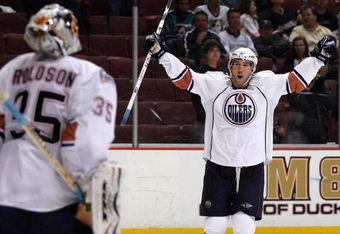 ANAHEIM, CA - MARCH 27: Sam Gagner #89 of the Edmonton Oilers raises his arms to teammate goaltender Dwayne Roloson #35 in celebration after they defeated the Anaheim Ducks 5-3 in their NHL game at Honda Center on March 27, 2009 in Anaheim, California. (Photo by Victor Decolongon/Getty Images)