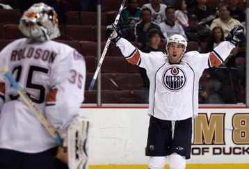 ANAHEIM, CA - MARCH 27: Sam Gagner #89 of the Edmonton Oilers raises his arms to teammate goaltender Dwayne Roloson #35 in celebration after they defeated the Anaheim Ducks 5-3 in their NHL game at Honda Center on March 27, 2009 in Anaheim, California. (Photo by Victor Decolongon/Getty Images)