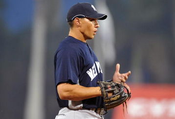 FORT MYERS, FL - MARCH 13:  Infielder Cody Ransom #12 of the New York Yankees sets fat third base against the Boston Red Sox March 13, 2009 at City of Palms Park in Fort Myers, Florida.  (Photo by Al Messerschmidt/Getty Images)