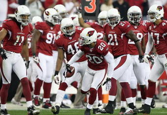 GLENDALE, AZ - JANUARY 03:  Ralph Brown #20 of the Arizona Cardinals celebrates with teammates after a first quarter interception against the Atlanta Falcons during the NFC Wild Card Game on January 3, 2009 at University of Phoenix Stadium in Glendale, Arizona.  The Cardinals defeated the Falcons 30-24. (Photo by Jed Jacobsohn/Getty Images)