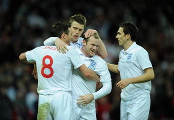 LONDON - MARCH 28:  Wayne Rooney of England celebrates with his team mates after he scored during the International Friendly match between England and Slovakia at Wembley Stadium on March 28, 2009 in London, England.  (Photo by Shaun Botterill/Getty Images)