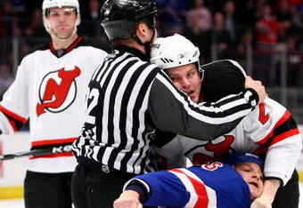 NEW YORK - MARCH 30: Sean Avery #16 of the New York Rangers wrestles with David Clarkson #23 of the New Jersey Devils during their game on March 30, 2009 at Madison Square Garden in New York City.  (Photo by Chris McGrath/Getty Images)