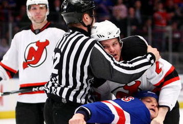 NEW YORK - MARCH 30: Sean Avery #16 of the New York Rangers wrestles with David Clarkson #23 of the New Jersey Devils during their game on March 30, 2009 at Madison Square Garden in New York City.  (Photo by Chris McGrath/Getty Images)
