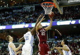 MEMPHIS, TN - MARCH 29:  Blake Griffin #23 of the Oklahoma Sooners goes up for a shot against Deon Thompson #21 and Danny Green #14 of the North Carolina Tar Heels during the NCAA Men's Basketball Tournament South Regional Final at the FedExForum on March 29, 2009 in Memphis, Tennessee. The Tar Heels defeated the Sooners 72-60 to advance to the Final Four.  (Photo by Joe Murphy/Getty Images)
